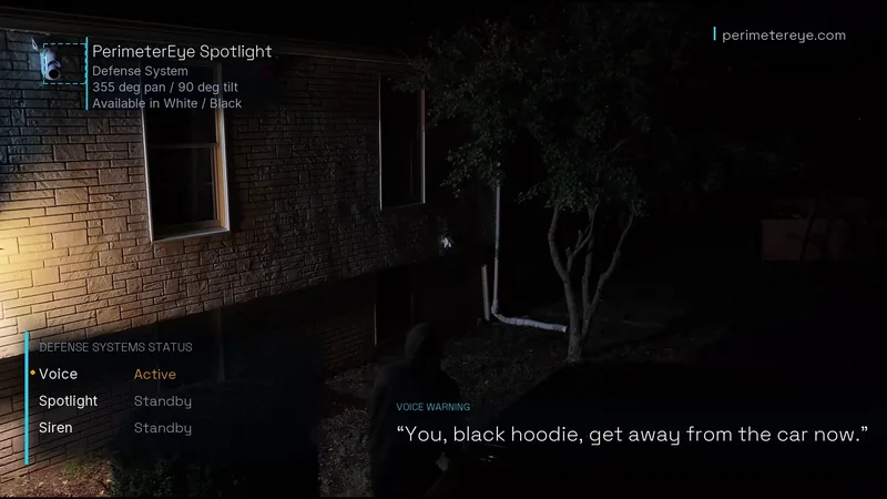 The status panel showing Voice active, with the spoken warning on screen as a person in a black hoodie stands at the car
