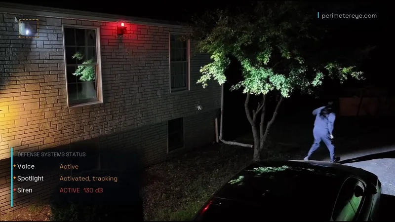 The red siren strobe on as the person runs from the car in the searchlight, with Siren active 130 dB on the status panel